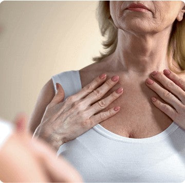 Woman touching her neck and chest